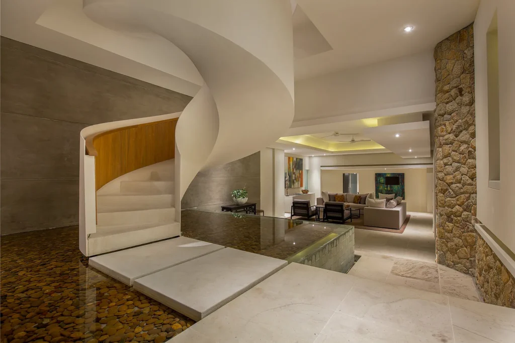 Luxury house interior with marble spiral staircase and reception hallway, Koh Samui