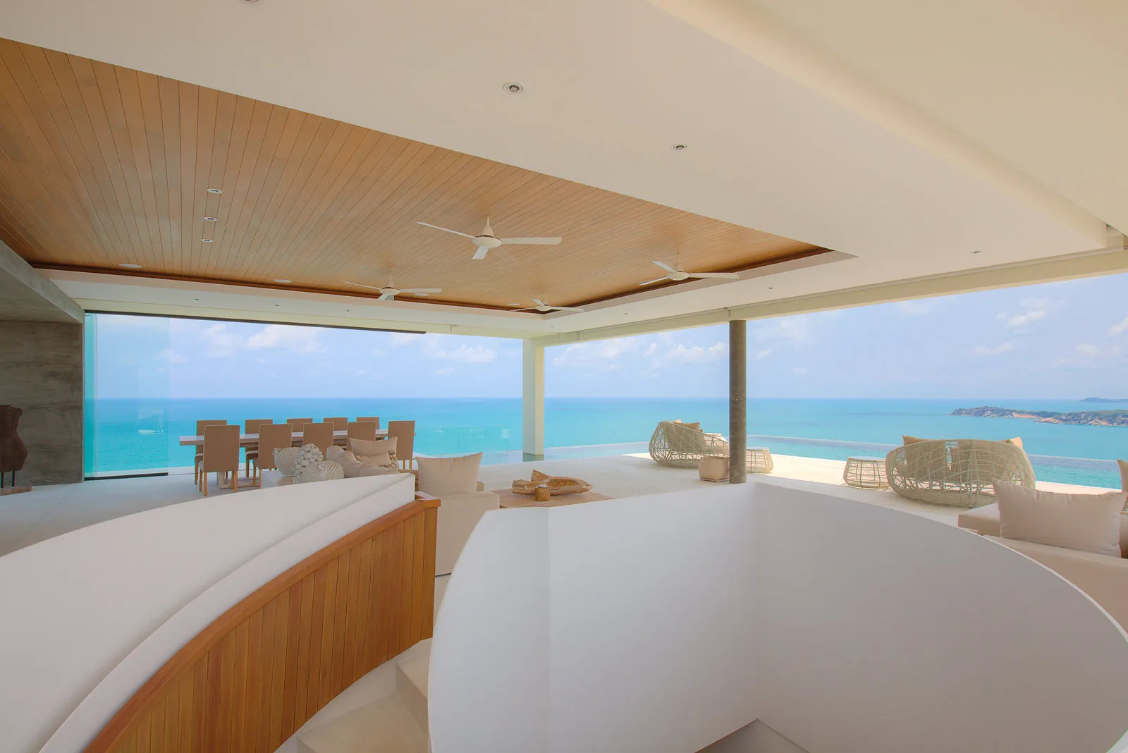 Open-air lounge pavilion overlooking turquoise sea, Koh Samui