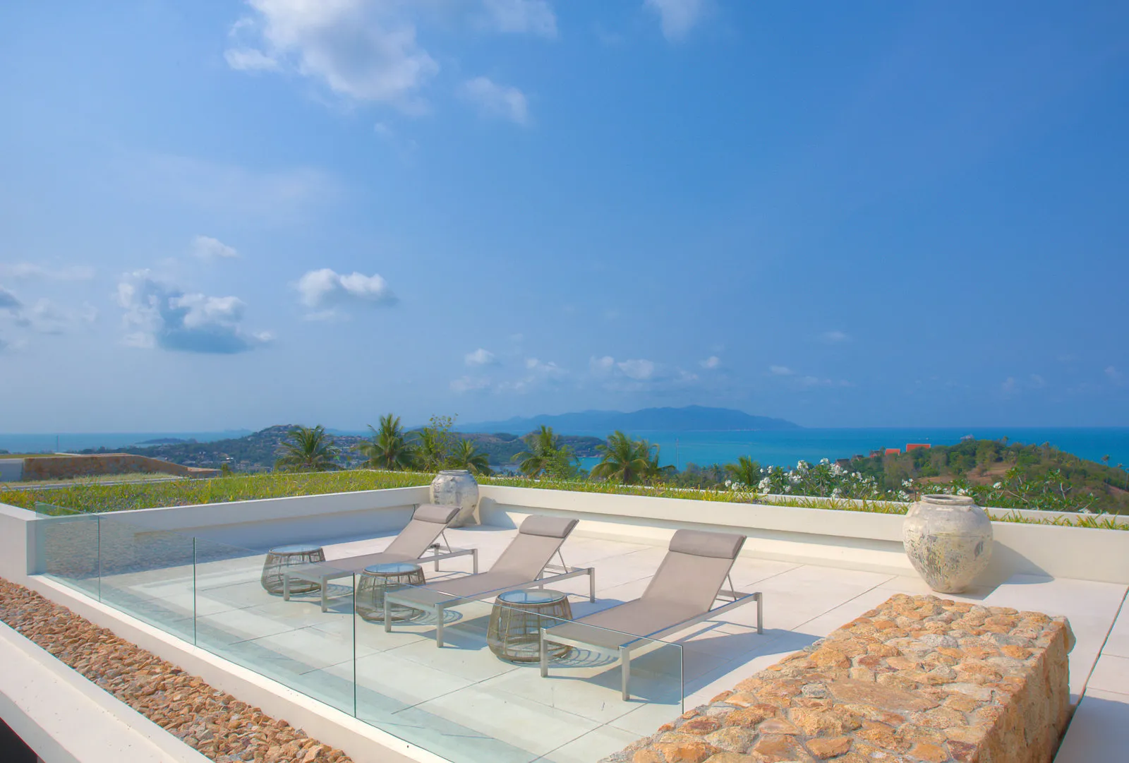 Upper terrace lounge and dining with expansive sea views across Koh Samui